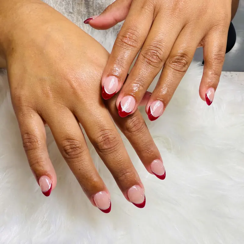 Deep red French tips on almond nails